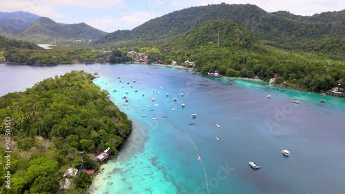 Motorboats Docked Along the Emerald Coastline