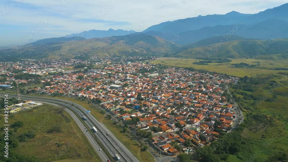 Small town in Brazil, flight over a small town in Brazil, natural light, drone flight. Itatiaia Town near highway
