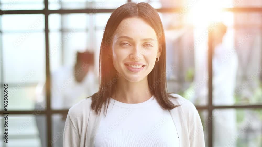 business woman with her staff in background at office business woman with her staff in background at office
