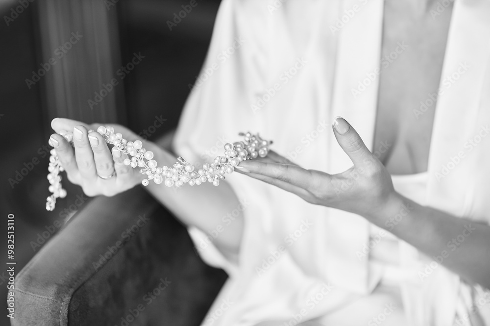 Bride Holding Elegant Pearl Necklace in Black and White – Timeless Elegance and Romance in Wedding Photography