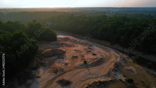 Aerial View of Deforested Area with Exposed Earth, Logging Debris, and Dense Jungle at Golden Hour in a Hyperrealistic Landscape