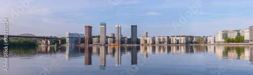 Panorama, skyscrapers apartment houses, the train bridges over the island at the Årstaviken, sunny summer morning in Stockholm