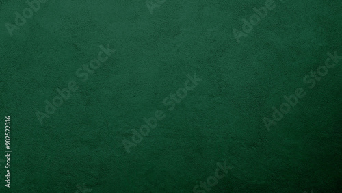 A green abstract texture background with a grunge canvas feel and wall-like structure. Perfect as an empty space for text or design elements.