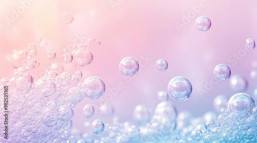 Water bubbles floating against a soft pastel gradient of pink and blue.