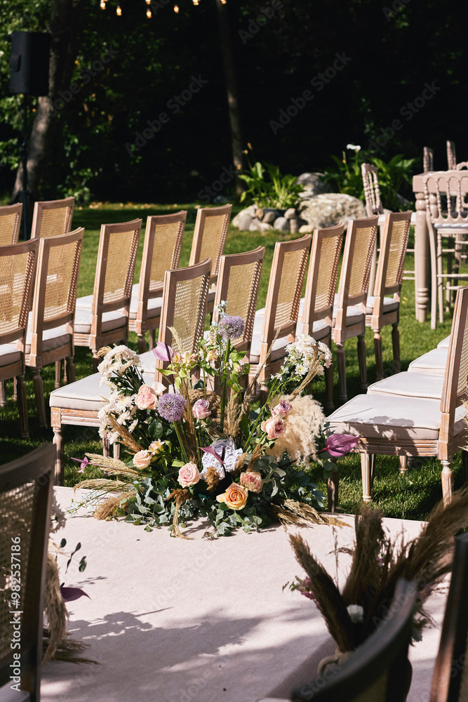 Charming Outdoor Garden Event with Wooden Tables, Soft Floral Decor, and Natural Greenery Ambience