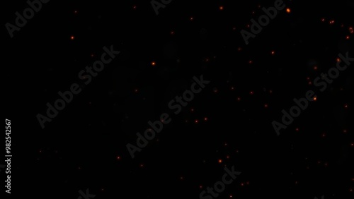 Glowing particles resembling embers from a fire, scattered against a black background, creating a dynamic and warm fiery atmosphere.