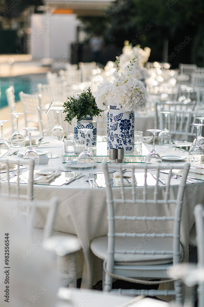 Romantic Wedding Preparation: Rings, Scissors, and Flowers on a Delicate Plate