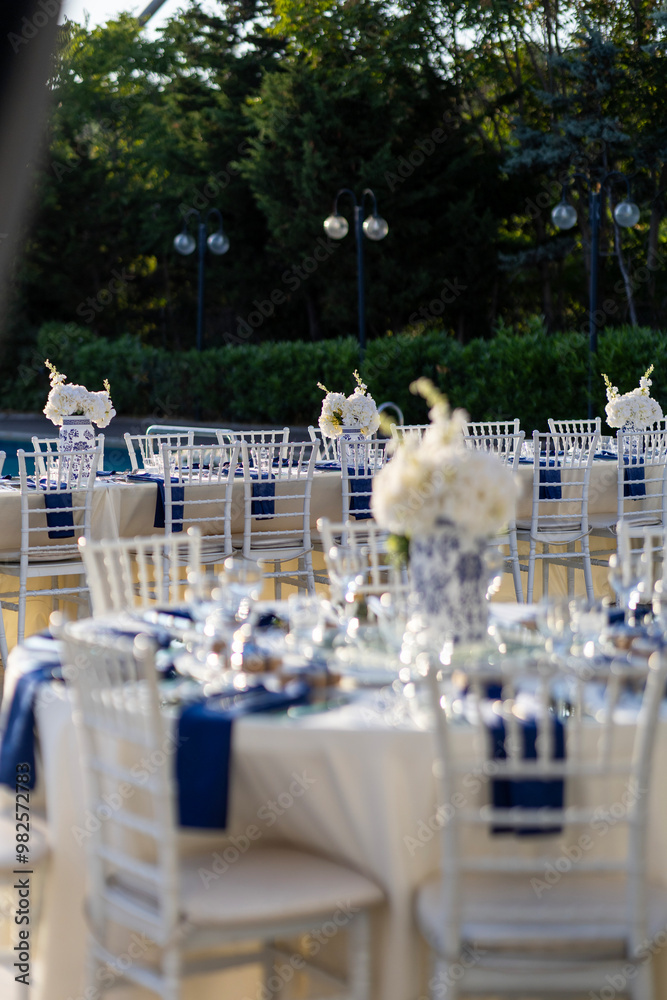 Elegant Outdoor Wedding Reception Table with Blue and White Theme