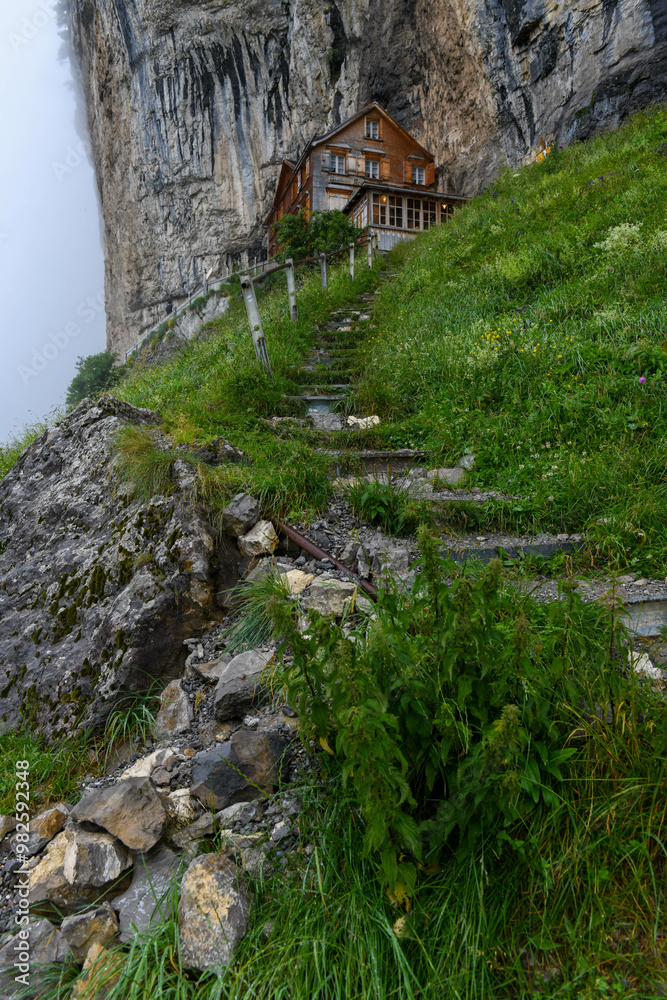 View at the famous mountain guesthouse Aescher at Ebenalp in the Swiss alps View at the famous mountain guesthouse Aescher at Ebenalp in the Swiss alps