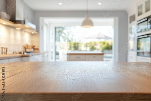 A copy space on wooden dining tabletop over blurred modern luxury white kitchen with generative ai