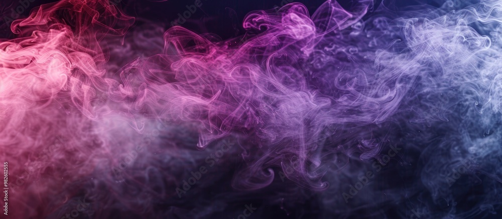 Obraz premium Dense Multicolored Smoke Of Pink And Purple Colors On A Black Isolated Background Background Of Smoke Vape