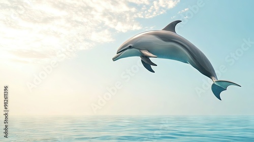 A dolphin in mid-air with a bright, sunny sky and ocean below. The vast, clear space around the dolphin provides a perfect area for copy.