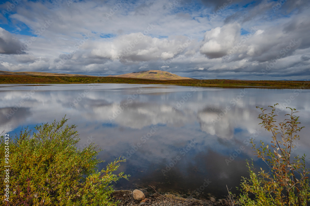Obraz premium Reflections at Two Moose Lake in Tombstone Territorial Park in Yukon Territory, Canada