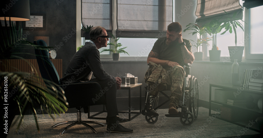Senior psychologist supports military man with disability. Male soldier in wheelchair shakes hands with psychotherapist after therapy session or rehabilitation. Psychological help and mental health. Senior psychologist supports military man with disability. Male soldier in wheelchair shakes hands with psychotherapist after therapy session or rehabilitation. Psychological help and mental health.