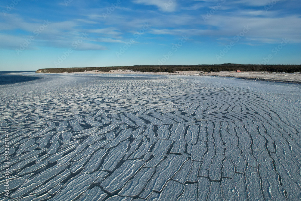Anticosti Stunning Coastline with Split Ice on the Seawater Surface in Fractal Patterns Seen From Above in the Northern Atlantic Ocean in Winter
