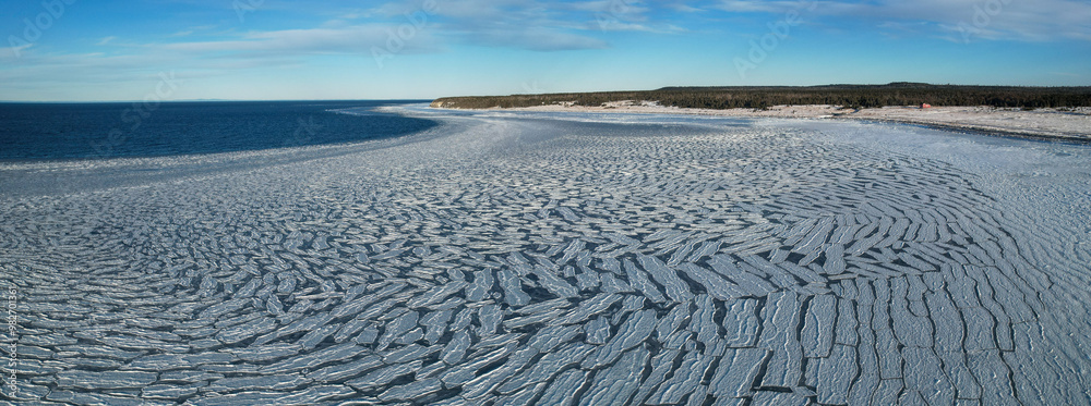 Anticosti Stunning Coastline with Split Ice on the Seawater Surface in Fractal Patterns Seen From Above in the Northern Atlantic Ocean in Winter