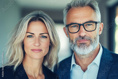 A confident couple looking directly at the camera.