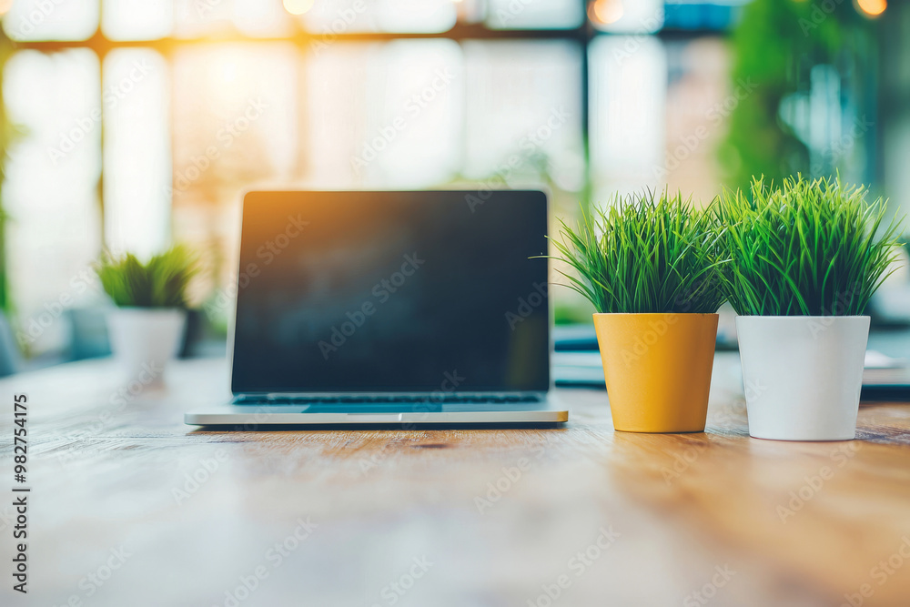 A laptop sits on a wooden desk, flanked by two potted plants. A laptop sits on a wooden desk, flanked by two potted plants.