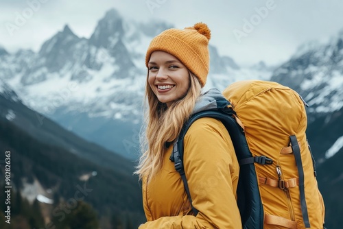 A smiling female traveler with a yellow hiking backpack enjoys the beautiful scenery of the majestic mountains. Travel, adventure. Concept of an active lifestyle, ai