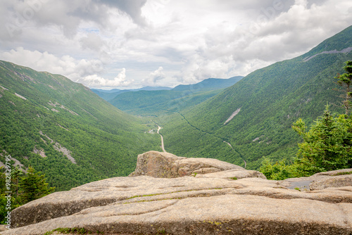 A rock juts out over the dramatic backdrop of Crawford Notch photo
