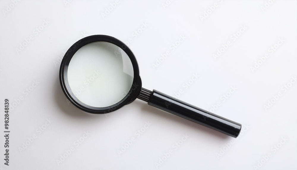 Magnifying glass on white background. Flat lay. Top view. Close-up. Magnifying glass on white background. Flat lay. Top view. Close-up.