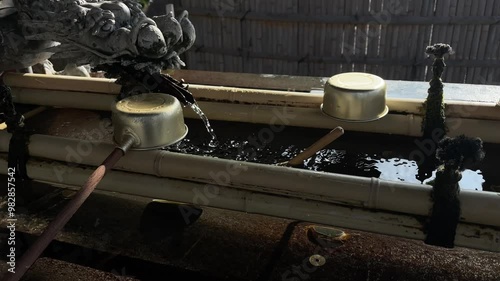 Water scoops in the shrine in Japanese temple Naritasan photo