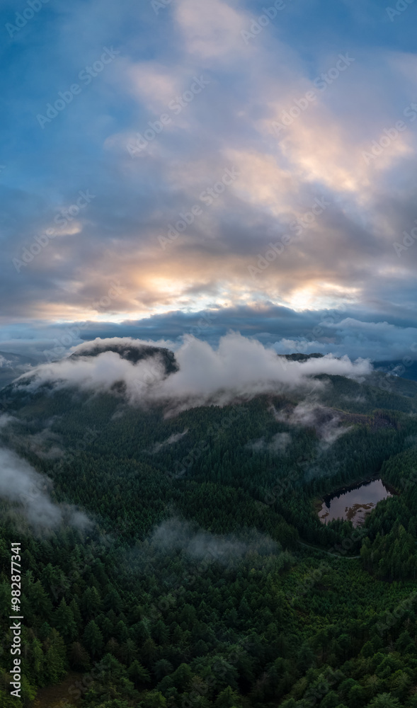 Breathtaking Aerial View of Misty Forests and Rolling Hills in British Columbia, Canada at Sunrise Breathtaking Aerial View of Misty Forests and Rolling Hills in British Columbia, Canada at Sunrise