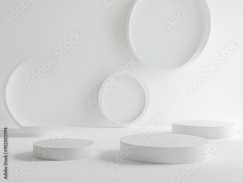 Minimalist design with abstract circular shapes in white space creates serene and modern atmosphere. smooth surfaces and soft shadows enhance overall aesthetic appeal