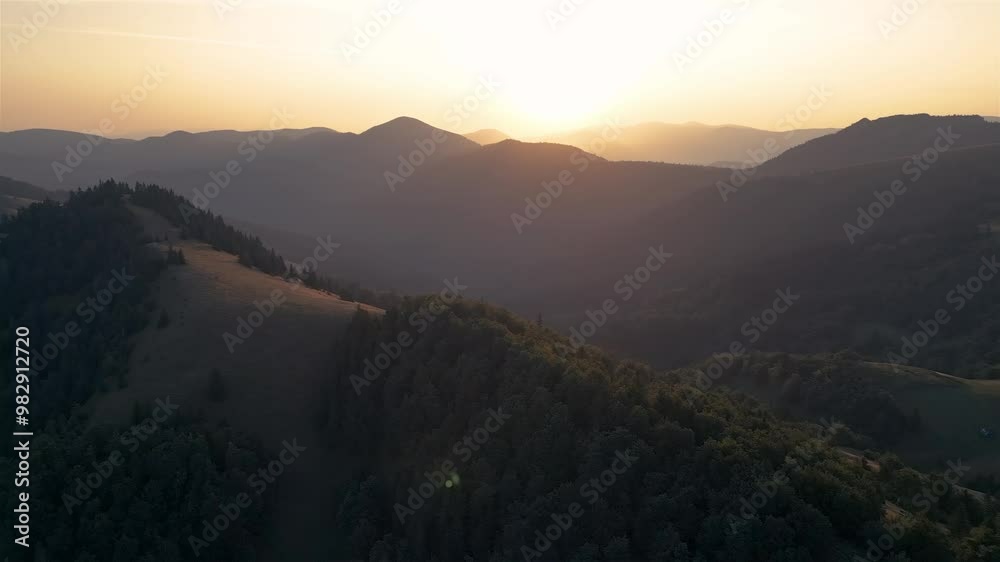 Aerial panorama of Carpathian forest mountains at golden sunrise Aerial panorama of Carpathian forest mountains at golden sunrise