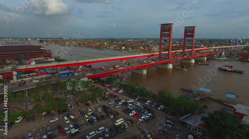 aerial footage ampera bridge in palembang city south sumatera indonesia, musi river, ampera red bridge photo