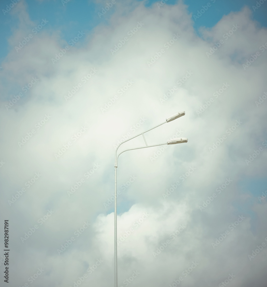 Simple Street Lamp Against Cloudy Sky, minimalist urban design Simple Street Lamp Against Cloudy Sky, minimalist urban design