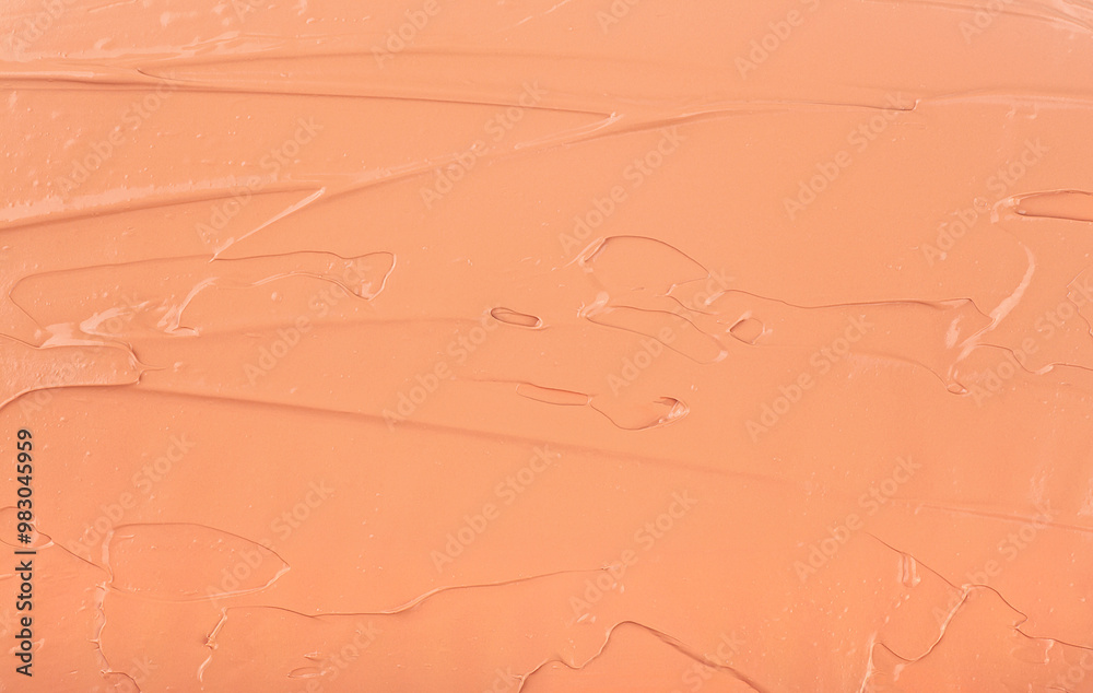 Fototapeta premium Liquid foundation makeup cream texture background. Texture of smudge cosmetic colored cream. Face foundation.
