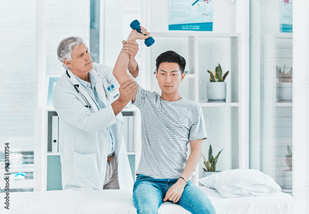 Fototapeta premium Man, doctor or patient with dumbbell for physiotherapy, checkup or muscle examination at clinic. Male person, therapist or physio with client or weightlifting for arm pain, ache or sprain at hospital
