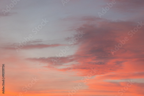 Colorful sunset sky with abstract cloud shapes in orange and purple hues, creating a dramatic and serene atmosphere