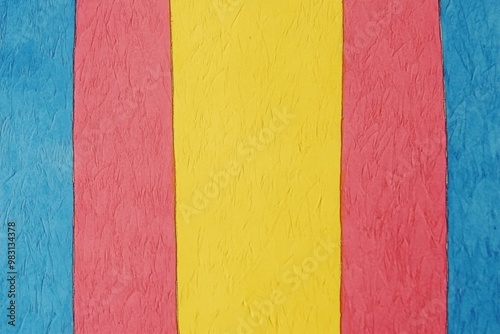 Abstract textured wall with vertical red, yellow, and blue stripes indoors