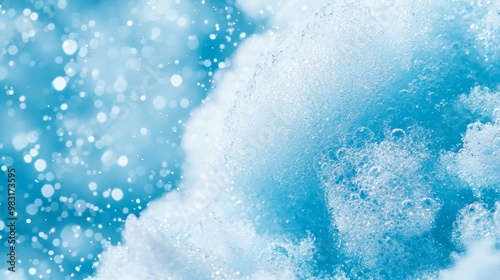  A tight shot of a blue-and-white backdrop featuring bubbles and water droplets at its base