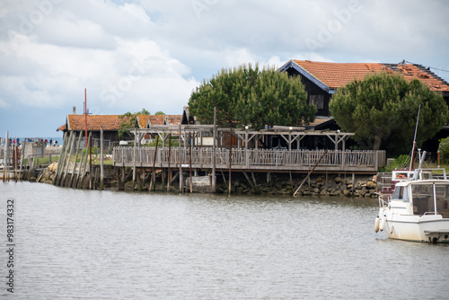 Travelling in France, old wooden huts and oysters farms in Gujan-Mestras village, cultivation and sale of fresh oysters seashells, Arcachon bay, Atlantic ocean, France, tourists destination photo