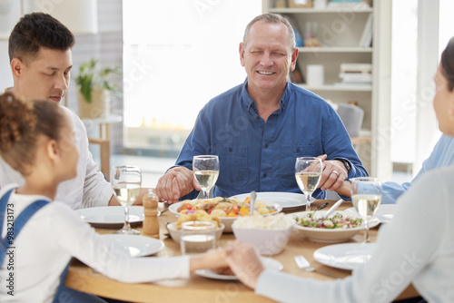 Home, big family and prayer with meal, holding hands and faith with lunch, nutrition and love. Praying, apartment or parents with girl, food or party with event, social gathering, belief or religion