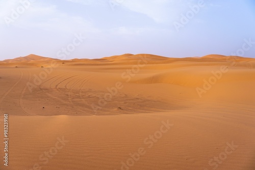 Fototapeta Naklejka Na Ścianę i Meble -  Golden sand dunes under a clear blue sky