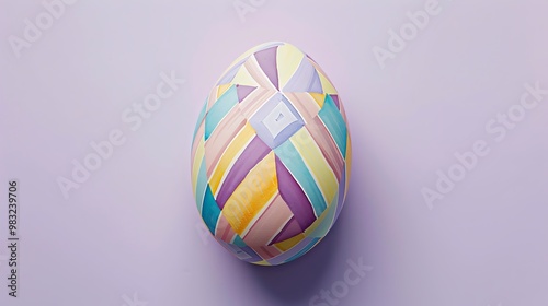 A pastel-colored Easter egg with a geometric design on a light purple background