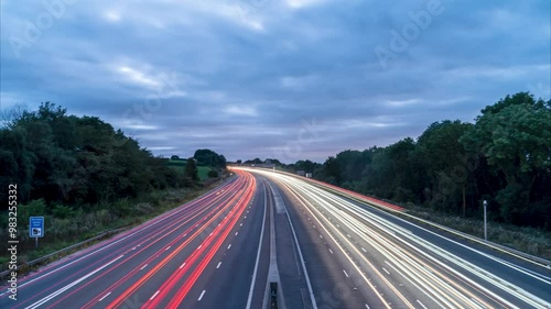 Traffic flowing on uk motorway at night