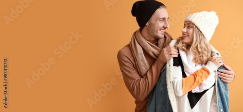 Happy young couple in warm ...