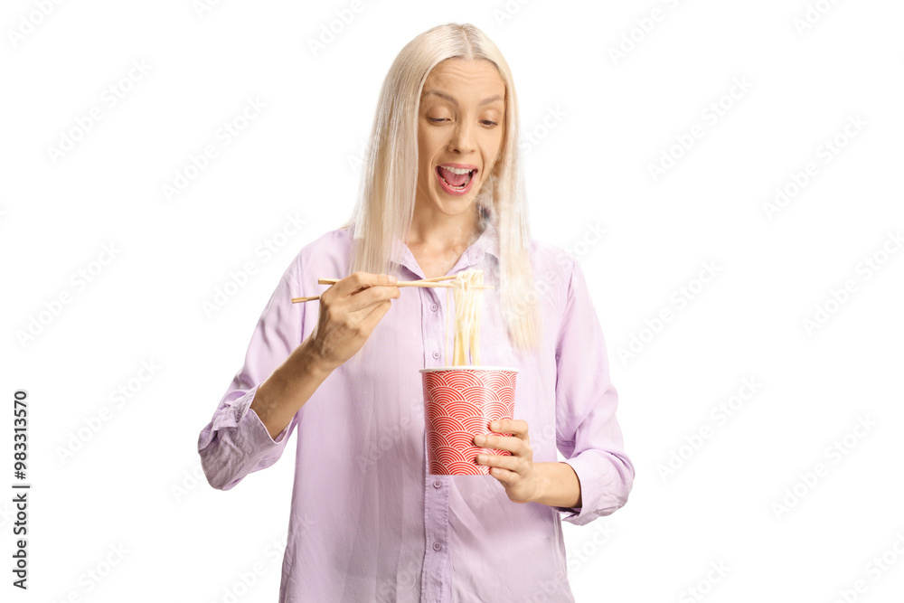 Excited young woman eating noodles from a takeaway box Excited young woman eating noodles from a takeaway box