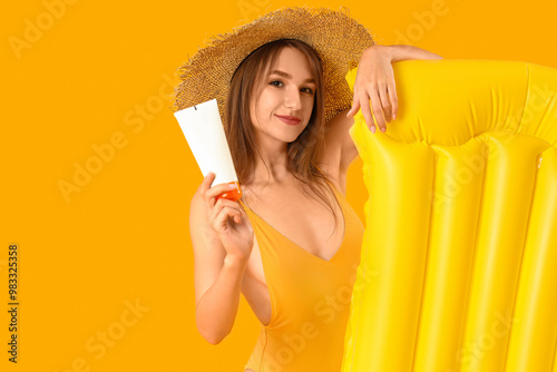 Young woman with sunscreen ...