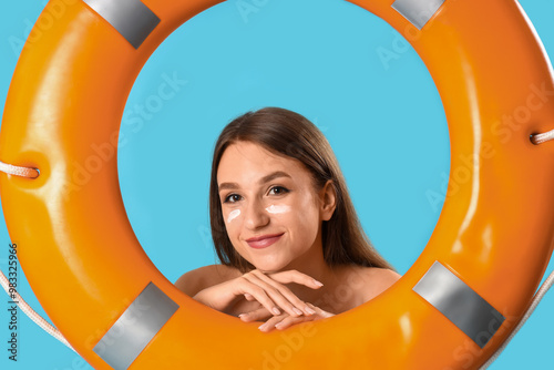 Young woman with sunscreen ...
