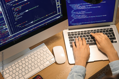 Female programmer working w...
