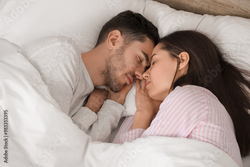 Young couple sleeping in bed