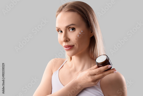 Beautiful woman with cream ...