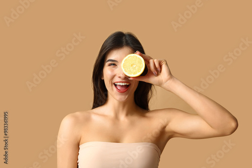 Happy young woman holding f...
