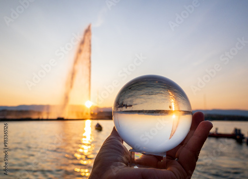 Crystal ball reflection of Geneva’s Jet d'eau at sunset